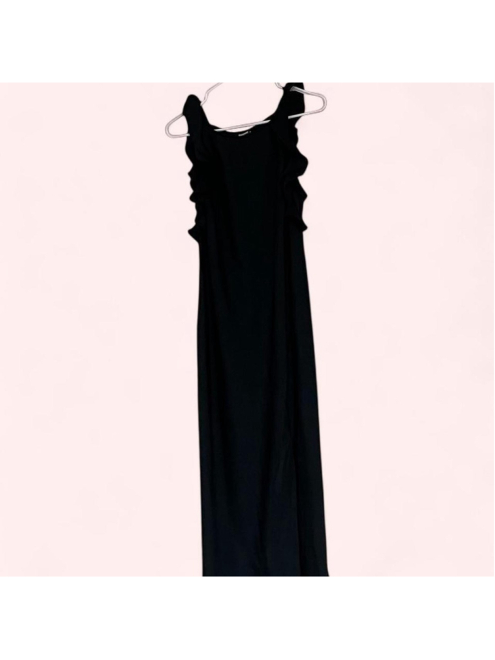 Black maxi dress, size M, with ruffle shoulder detail and a simple fitted silhou